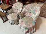 two chairs and a ottoman in a room