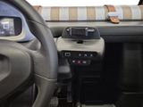 steering wheel and dashboard of a car with a clock on the dashboard