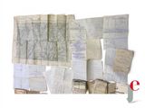 many old maps and papers on a white background