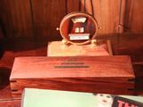 a wooden box with a clock on top of it
