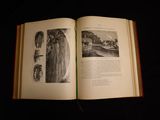an open book with a picture of a castle on it