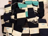 many pairs of men ' s socks that are on a table