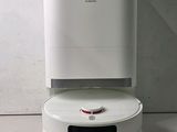 an image of a white water heater sitting on top of a counter