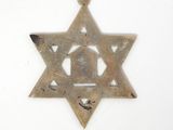 a star of david with a bell hanging from it ' s side