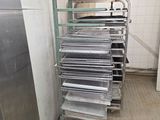 a lot of racks of food in a kitchen