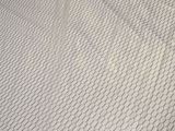 a mattress that has been made and is laying on the floor