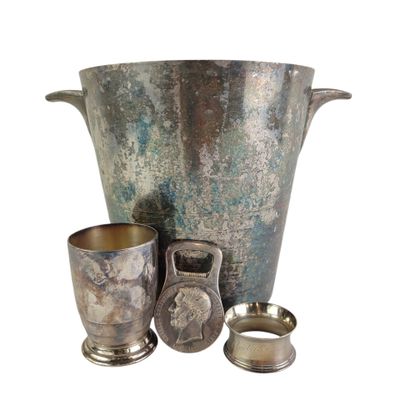 a silver vase and two cups sitting next to each other