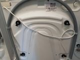 an image of a white washer sitting on top of a wooden pallet