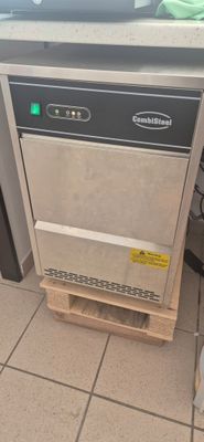 an image of a commercial dishwasher in a kitchen