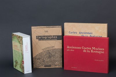 three books are sitting on a table next to each other