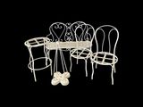 four chairs and a table that are sitting on a black background