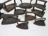 a lot of old iron items that are on a table