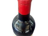 a bottle of wine that is sitting on a table