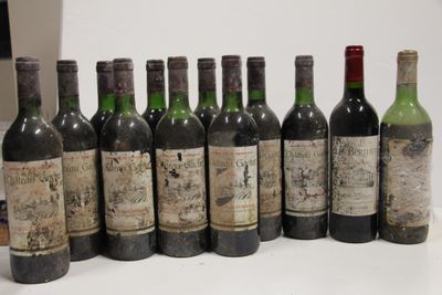 several bottles of wine are lined up in a row on a table