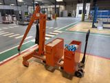 a picture of a forklift with a cart full of sodas