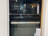 an oven that is built into the wall in the kitchen