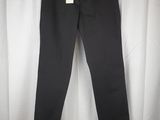 a pair of black pants hanging on a white curtain