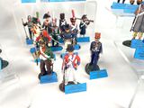 many figurines of soldiers on display in a display case