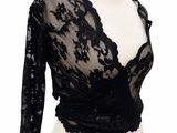a mannequin torso with a black lace top and skirt