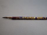 a pen that is sitting on a table