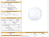 un gros plan d'un document sur lequel figure la photo d'une voiture