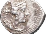 a silver coin with a head of a deer on it