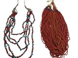 pair of red and blue beaded necklaces on a white background