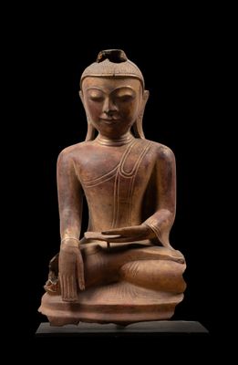 une image représentant une statue d'une personne assise en position de méditation