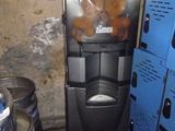 an image of a machine that has some donuts in it