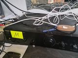 many wires and cords on the top of a radio