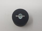 an oval aquamarinee gemstone ring in a black box