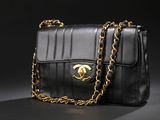 a black chanel bag with gold chain