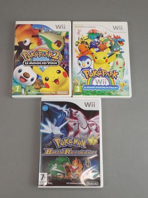 three nintendo wii games are sitting on top of a table