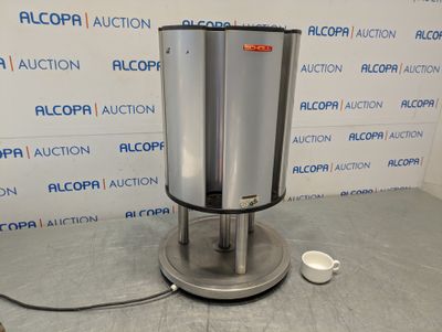 an image of a stainless steel water dispenser sitting on a table