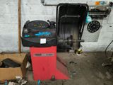 a machine that is sitting in a garage next to a box