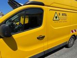 a yellow van that is parked on the side of the road
