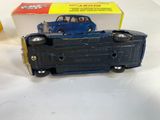 a blue toy car with a box on the table