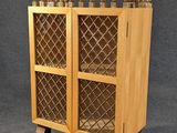 a tall wooden cabinet with glass doors on a stand