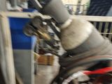 a man that is sitting on a bike in a garage