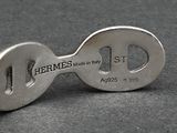 a close up of a silver key on a table