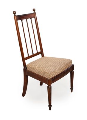 an image of a wooden chair with a tan upholstered seat