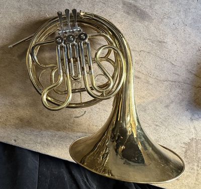 a brass instrument that is sitting on a table