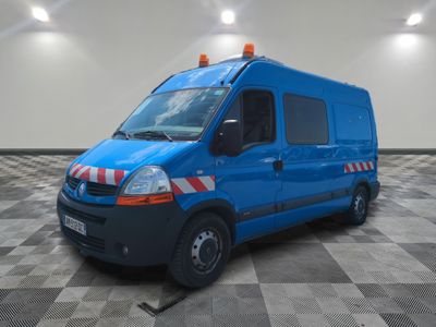 a picture of a blue van parked in a large room