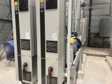 two industrial air conditioning units in a building