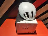 a white helmet on top of a box on a table