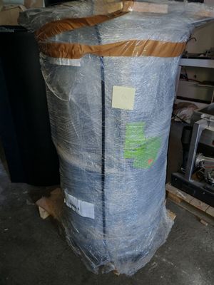 a large bag of plastic wrapped up in a warehouse