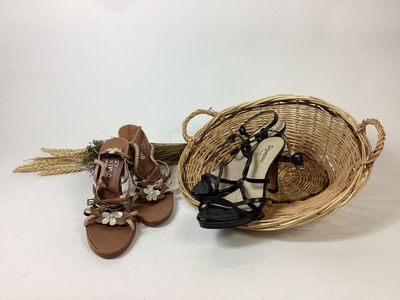 two pairs of sandals and a basket on a white background