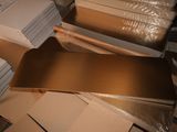a pile of cardboard and cardboard boxes on the floor