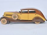 a toy car that is sitting on a white surface