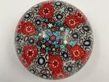 a close up of a glass object on a white surface